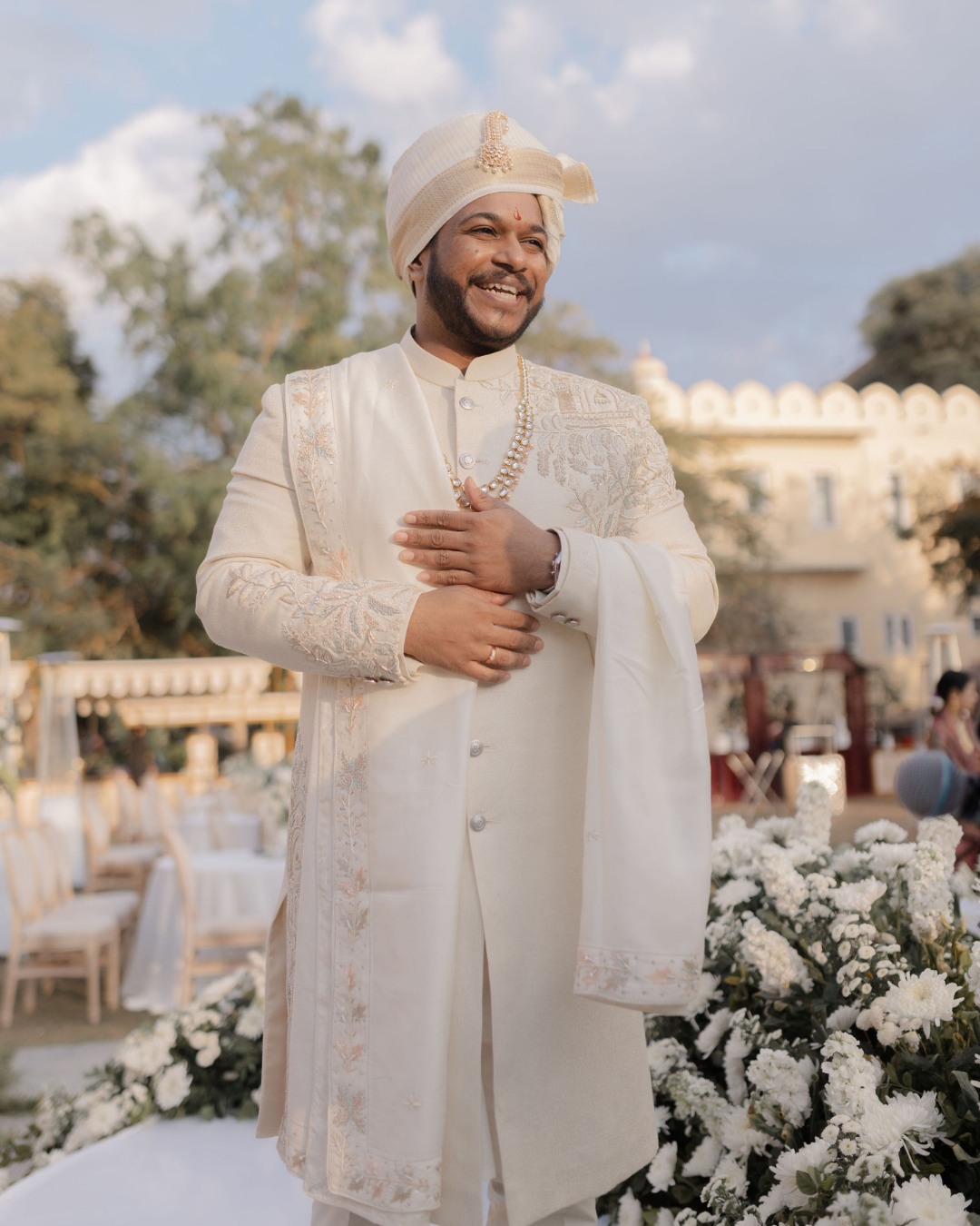The groom in an ivory sherwani — Anupama & Abhinav, Mundota Palace, Jaipur
