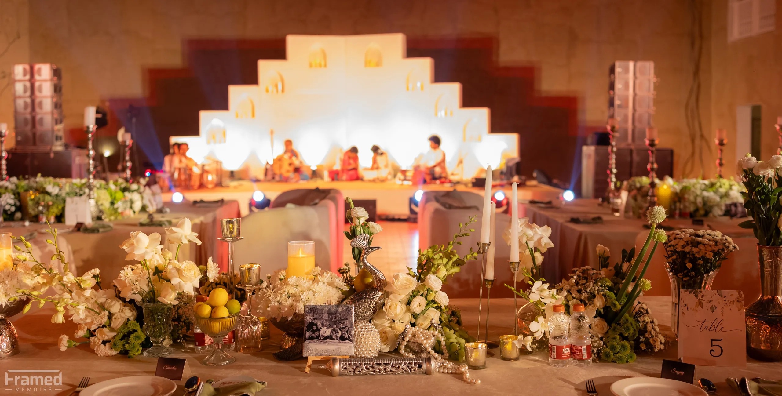 Dinner tables with candles and white florals