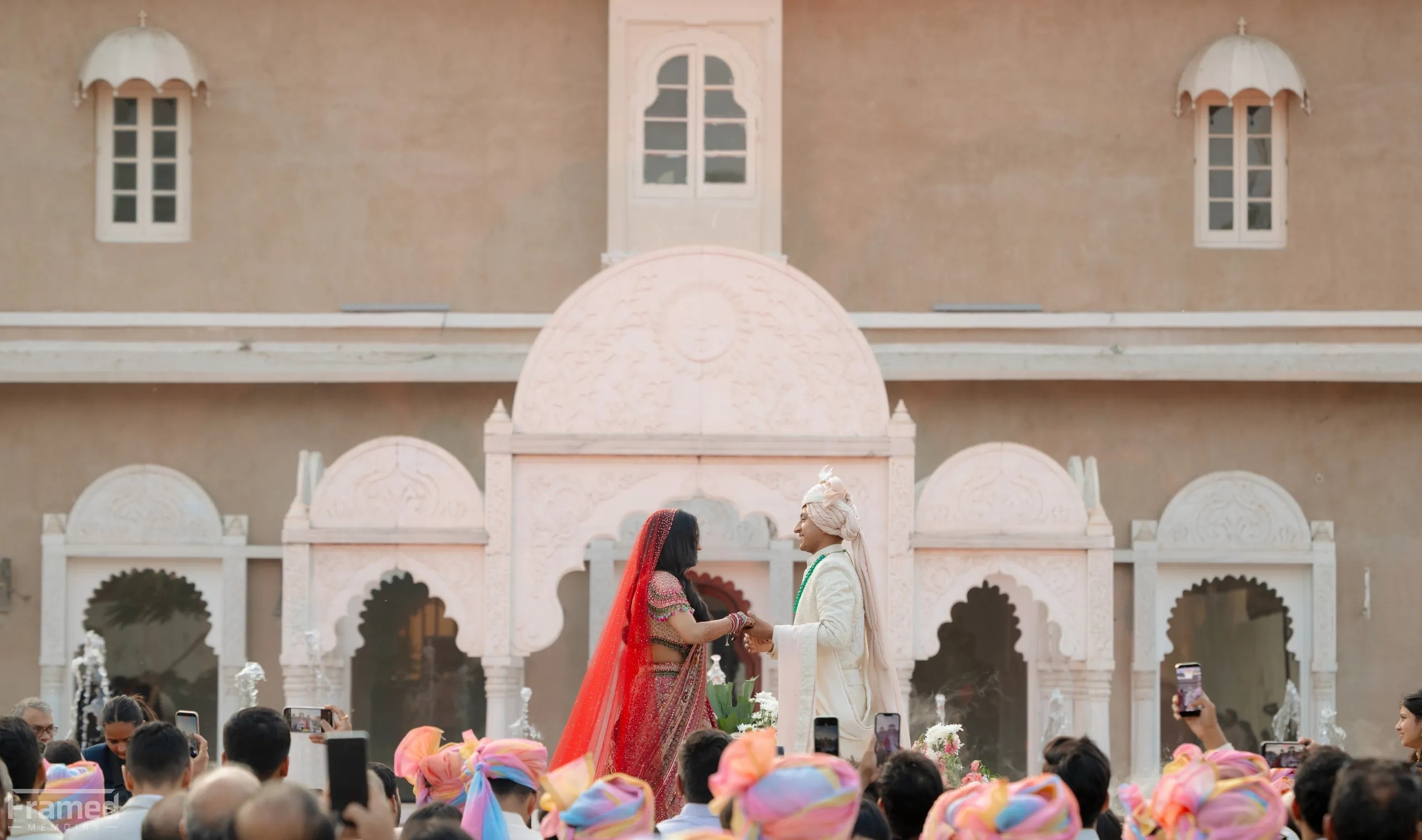 The couple arrives in the palace courtyard — Devanshi & Rohan, Taj Lalit Bagh, Udaipur